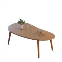 Table basse moderne et organique en MDF monobloc artisanal pour le salon