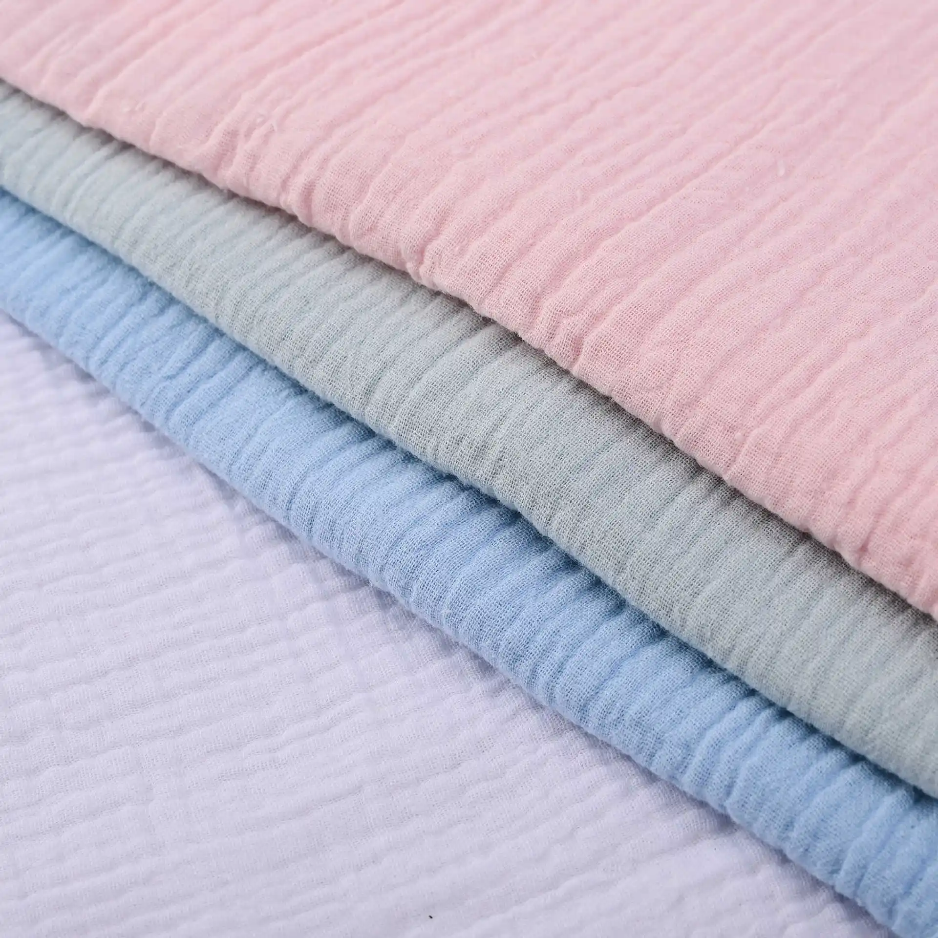 Filato colorato pettinato personalizzato, 180gsm 100 cotone organico lavorato a maglia Single Jersey rotoli di tessuto assorbente per l'umidità per vestiti per bambini/