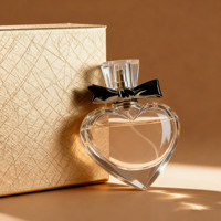 Flacon de parfum sphérique en verre transparent de luxe en forme de cœur 100 ml 50 ml 60 ml 100 ml avec bouchon et vaporisateur personnalisé Boîte d'emballage
