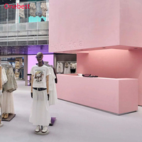 Comptoir de caisse moderne en surface solide rose pour magasin de vêtements pour femmes et dames, kiosque d'accueil, présentoir
