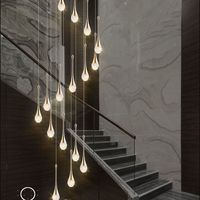 Lustre en cristal rotatif de luxe pour l'installation de suspension d'escalier de villa