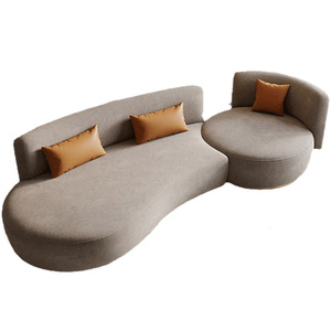 โซฟาผ้ารูปตัว S โค้งมน พร้อมหมอนสีส้ม สำหรับห้องนั่งเล่นสไตล์โมเดิร์น - Product Image 5