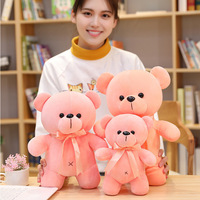 Großhandel Bunte Teddybären aus Plüsch |   5 Farben Bärchen-Stofftier mit Schleife |   Niedliches Cartoon-Weichdaunen-Baumwoll-Teddybär-Spielzeug für Kinder