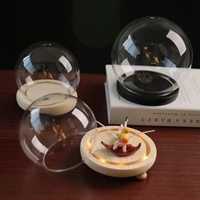 Clochette en forme de boule transparente, dôme de verre avec base en bois