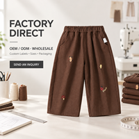 Celana Panjang Anak Laki-Laki Warna Cokelat Model Straight Leg dengan Motif Kartun Kecil, Pinggang Elastis, Saku Samping, dan Ujung Terbuka