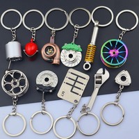 Mini porte-clés amusants en métal 3D en forme de pièces automobiles (turbine, moyeu de roue) avec moulage sous pression et sérigraphie, logo personnalisé, en gros