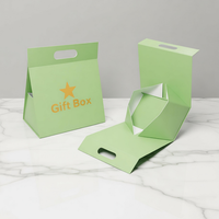 Boîte cadeau pliable de luxe noire avec poignée découpée, fermeture magnétique sécurisée et doublure en éponge pour crème visage – Emballage haut de gamme
