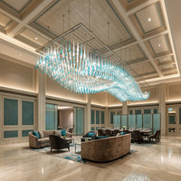 Lustre suspendu ovale en verre personnalisé en forme de goutte d'eau avec télécommande pour hall d'hôtel, luminaire de projet moderne en acier inoxydable