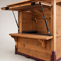 Kiosque pliant en bois pour stand alimentaire de Noël, utilisation événementielle ou en marché.