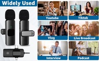 Microphone Lavalier Sans Fil Professionnel K9 Mini Portable en Métal 1 Émetteur 2 Récepteurs avec Fonction d'Enregistrement et Réduction du Bruit Compatible Téléphone