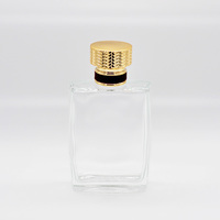 Flacon de parfum rectangulaire transparent en verre Fairy FR109 100ml au design moderne avec couvercle doré, pulvérisateur à pompe et finition estampée à chaud