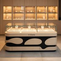Comptoir d'exposition de bijoux personnalisé en verre avec éclairage LED, mobilier de présentation pour bijouterie avec logo de marque