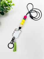 En gros Porte-badge rétractable en silicone avec perles, en forme de crayon, carnet et crayon de couleur, avec cordon et porte-clés, pour porte-carte d'identité d'enseignant et d'étudiant