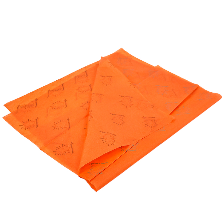 Vibrant Orange Packaging Paper with Black Burst Pattern for Gift Wrapping and Retail Product Presentation
