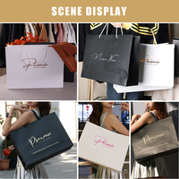 Bolsa de papel con logotipo impreso personalizado, ropa de lujo, bolsas de papel para compras, bolsa de regalo reciclable Boutique con cuerda de cinta