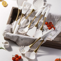 Meilleure vente : Ustensiles de cuisine en silicone de qualité alimentaire avec manche en acier inoxydable doré – Spatule, cuillère et passoire sûrs pour la cuisine