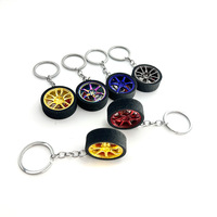 Porte-clés créatif en métal en forme de roue de voiture de dessin animé, porte-clés turbo, porte-clés jante de pneu simulée pour les amateurs de voitures - Vente en gros