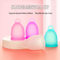 Mini copa menstrual reutilizable de material de silicona de grado alimenticio personalizado con tirador para dama