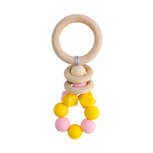 Nouveau bricolage créatif <span class=keywords><strong>anneau</strong></span> en bois <span class=keywords><strong>Gel</strong></span> <span class=keywords><strong>de</strong></span> <span class=keywords><strong>dentition</strong></span> bébé apaisant bicolore Silicone jouet pour grincer des dents - Product Image 1