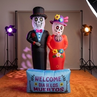 Squelette gonflable de couple du Jour des Morts en tenue formelle noire et rouge avec panneau de message pour décoration lumineuse de fête