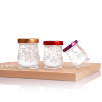 Nouveau modèle OEM Pot à confiture de miel Bocal en verre pour le stockage des aliments Préserver le miel Bocal en verre de 50 ml 75 ml 100 ml avec couvercles