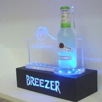 Vente directe haut de gamme illuminé acrylique LED casier à vin présentoir créatif pour comptoir de bar étagère à liqueur de luxe