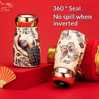 Nouvelle tasse isotherme portable 2025 de style chinois, en acier inoxydable, avec affichage de la température et poche intérieure, au design esthétique.