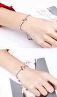 Venta al por mayor de acero inoxidable en forma de bambú letra inicial a prueba de agua no Tanish colgante pulseras de joyería de moda para las mujeres