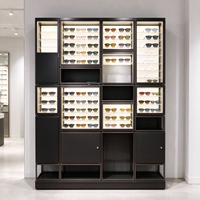 Comptoir îlot en verre noir pour magasin d'optique avec étagères lumineuses pour présentation de lunettes CE ETL