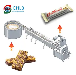 Barre énergétique automatique à grande vitesse craquelin de riz rouleaux d'oeufs alimentation tri flux machine d'emballage avec plateau tournant