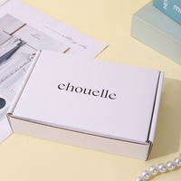 Emballage cadeau sophistiqué pour bijoux en ivoire A1 avec tiroirs de présentation noirs et architecture de boîtes multi-tailles raffinée