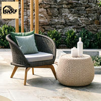 Ensemble de salon de jardin en rotin avec table basse, dossier incurvé tressé et pieds en bois de teck pour terrasse, villa, jardin, hôtellerie, patio