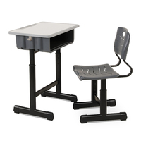 Vente directe d'usine de mobilier scolaire : Ensemble pupitre et chaise de classe à cadre noir avec sièges en plastique moulé monobloc