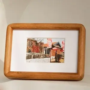Rounded Wooden Photo Frames Placing on the Table for Home Decoration