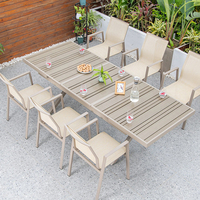 Ensemble de salle à manger d'extérieur nordique en aluminium et WPC, table et fauteuils empilables en textilène, résistant aux intempéries, pour jardin et patio