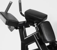 Machine à pédales pour fessiers 100 kg, à pédales pendulaires, pour extensions de hanche à genoux, avec positionnement réglable du pied, à charge par plaques, usage commercial en salle de sport