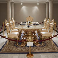 Table à manger élégante d'inspiration baroque, cadre sculpté doré, plateau en marbre, parfaite pour les banquets à domicile haut de gamme ou les événements formels