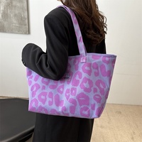 Nouveau sac fourre-tout tendance en toile grande capacité pour femme, motif léopard, style niche, à porter à l'épaule ou sous le bras