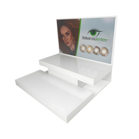 Étagère d'exposition de lentilles de contact anti-vol en acrylique blanc moderne à double couche personnalisée pour les magasins de beauté