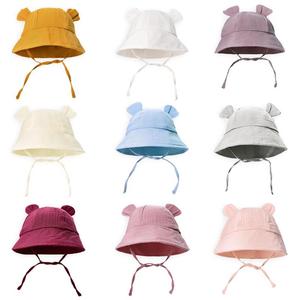 Sombrero de cubo de algodón puro de Color sólido para niños pequeños, <span class=keywords><strong>gorra</strong></span> de playa de protección solar para bebé recién nacido, <span class=keywords><strong>gorra</strong></span> de lavabo estampada transpirable para viajes al aire libre - Product Image 1