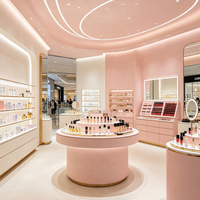 Écrins de présentation cosmétiques roses personnalisés et vitrines murales rétroéclairées par LED, idéales pour les boutiques de maquillage et de rouges à lèvres