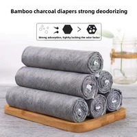 Tapis absorbants pour animaux de compagnie en tissu non tissé et charbon de bambou à forte absorption d'eau pour l'apprentissage de la propreté des chiots
