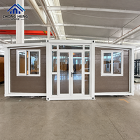 Entrée centrale en verre avec fenêtres supérieures et latérales pour projets résidentiels modernes, maison conteneur extensible