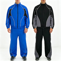Ensemble de survêtement décontracté 2 pièces pour homme avec logo personnalisé, blocs de couleur, rayures, fermeture éclair intégrale, col montant et pantalon large style streetwear