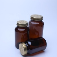 Botol Kaca Buram Berkualitas Tinggi 100cc 200cc 300cc Botol Kaca Soda-lime Berwarna Amber Biru untuk Suplemen Dengan Tutup Logam