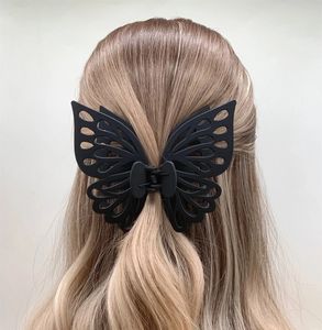 Qianjin工場卸売ダブル中空シャーククリップつや消しマット大型プラスチックバタフライヘアクロー - Product Image 1