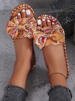 Sandales plates décontractées pour femmes, tendance mode, avec empeigne en toile imprimée, bout ouvert, semelle en caoutchouc antidérapante et nœuds, pour l'extérieur, vente en gros