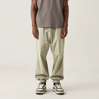 Pantalon de survêtement ample en molleton bouclette avec cordon de serrage, idéal pour le sport, la course et les activités de plein air, un essentiel unisexe pour hommes et femmes.