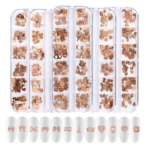 Paso Sico <span class=keywords><strong>2021</strong></span> 24 diseños 12 espacios en blanco Metal mixto patrón pequeño remache Retro colores Flor Mariposa corazón estrella Nail Art diseño 3D - Product Image 2