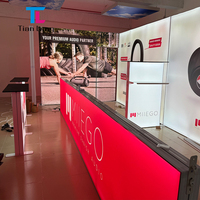 Stand de toile de fond modulaire réutilisable en aluminium pour salon professionnel, présentoir lumineux LED imprimé sur mesure avec comptoir d'accueil pour exposition